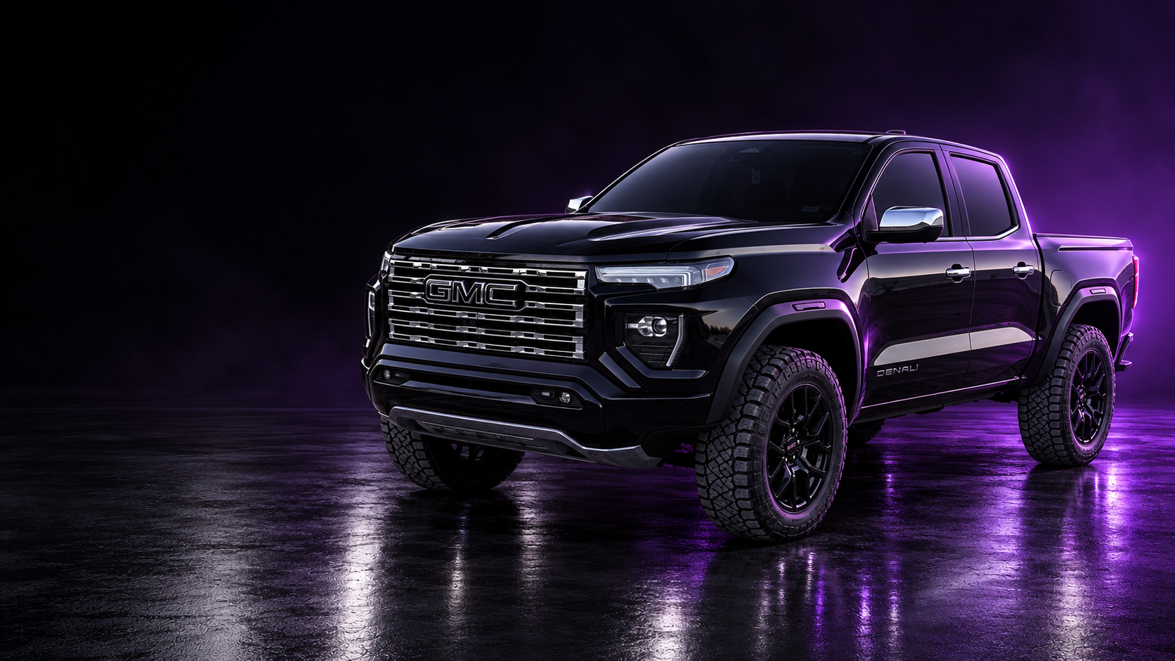 Alex’s black GMC Canyon Denali with off-road tires, chrome trim, and subtle purple studio lighting